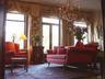 Living with large windows facing the park and door to French