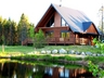 Click to enlarge log home and cottage rentals in front of water. in Ste-Christine D'Auvergne,Quebec