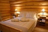 Master bedroom in the Eider log cabin