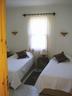 Twin bedroom in main villa