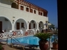 View of the pool and some rooms from the restaurant