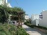drive along front of villa, parking area to the side
