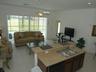 comfy living room overlooks the pool area