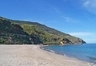 The sandy beach in front the Villa