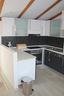New kitchen has hob, oven, fridge, freezer and dishwasher