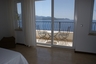 Master bedroom with private sea view balcony