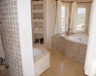 Impressive master en suite bathroom with sea view bath and w