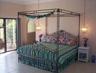 Master bedroom with king bed opens to pool, private bath, dr