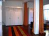 19V Long view of East wall of windows to far end of Livingroom