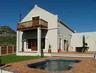 View of the private garden, pool, entertainment area and bbq