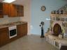 KITCHEN WITH STONE DALMATIAN FIRE PLACE