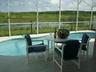 table and chairs overlooking lake 