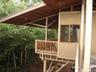 Guest house bedrooms share a balcony with ocean view