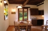 Kitchen dining room with glass door leading onto the veranda