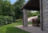 Veranda with oak beamed ceiling & patio furniture for al fresco meals