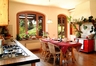 Air Con Kitchen with glass door leading onto the veranda 