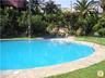 One of the 2 communal pools set in Lovely Gardens with Waterfall Feature