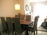 The solid wooden dining table, seats 8