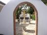 Archway leading to BBQ area.