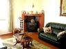 Sunny Sitting Room with Feature Fireplace.