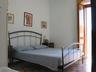 western bedroom with balcony and view on the seaside