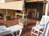 the terrasse with awning and 8  long chairs