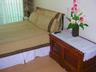 Comfortable queen size bed in spacious bedroom