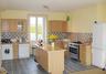 Brand new fitted kitchen with five ring cooker